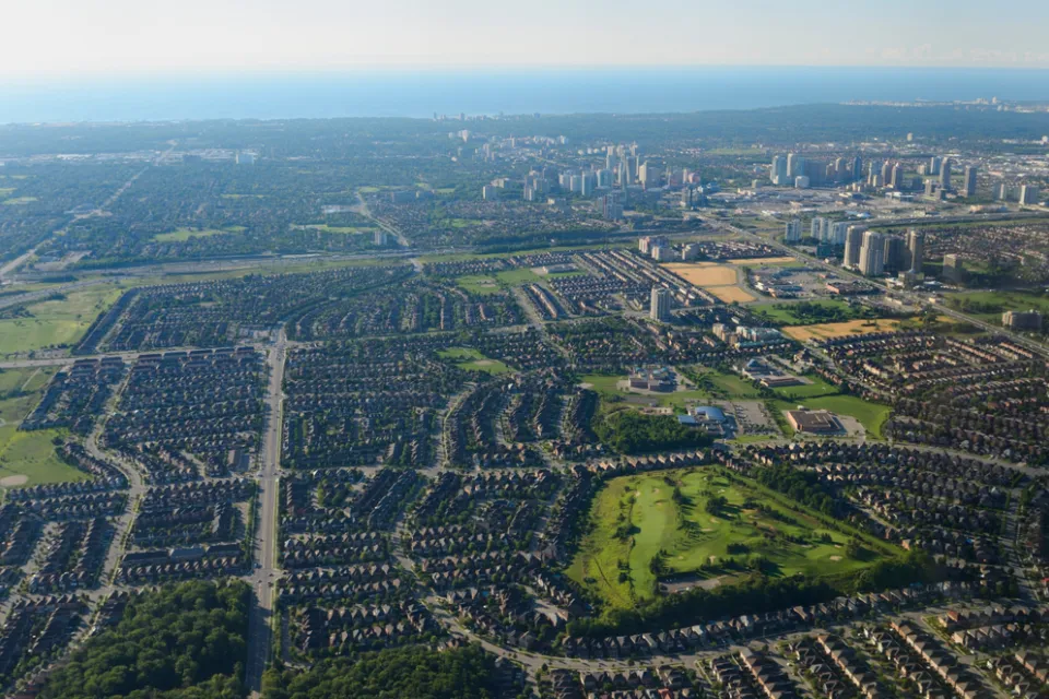 An aerial view of Mississauga, Ontario, with Lake Ontario in the background.